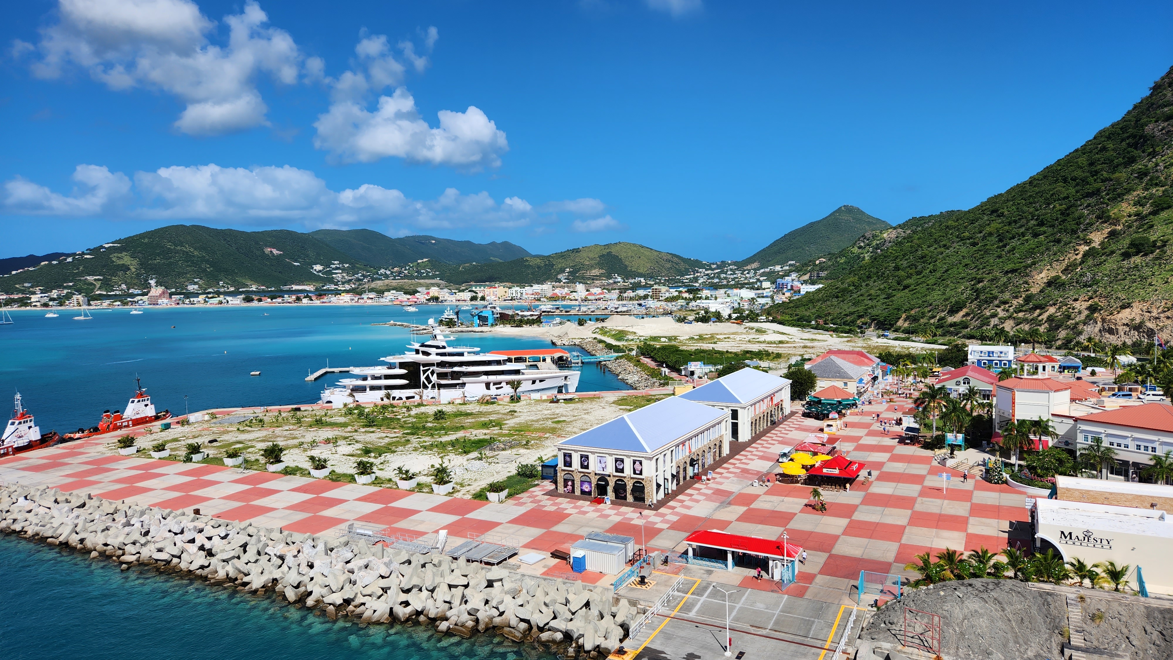 Caribbean island harbor surrounded by green mountains