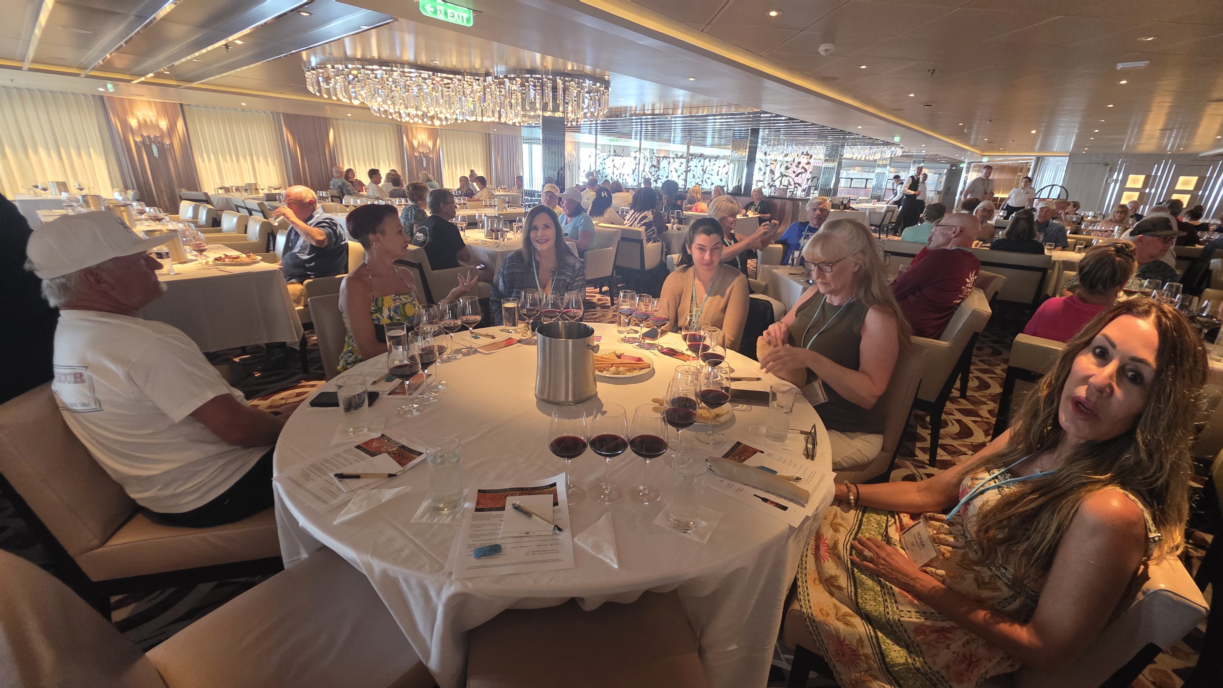 Guests gathered for a large hosted wine tasting event during an Ascension Cellars cruise.